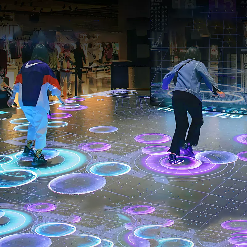 Interactive LED floor and foldable DJ booth setup at birthday party